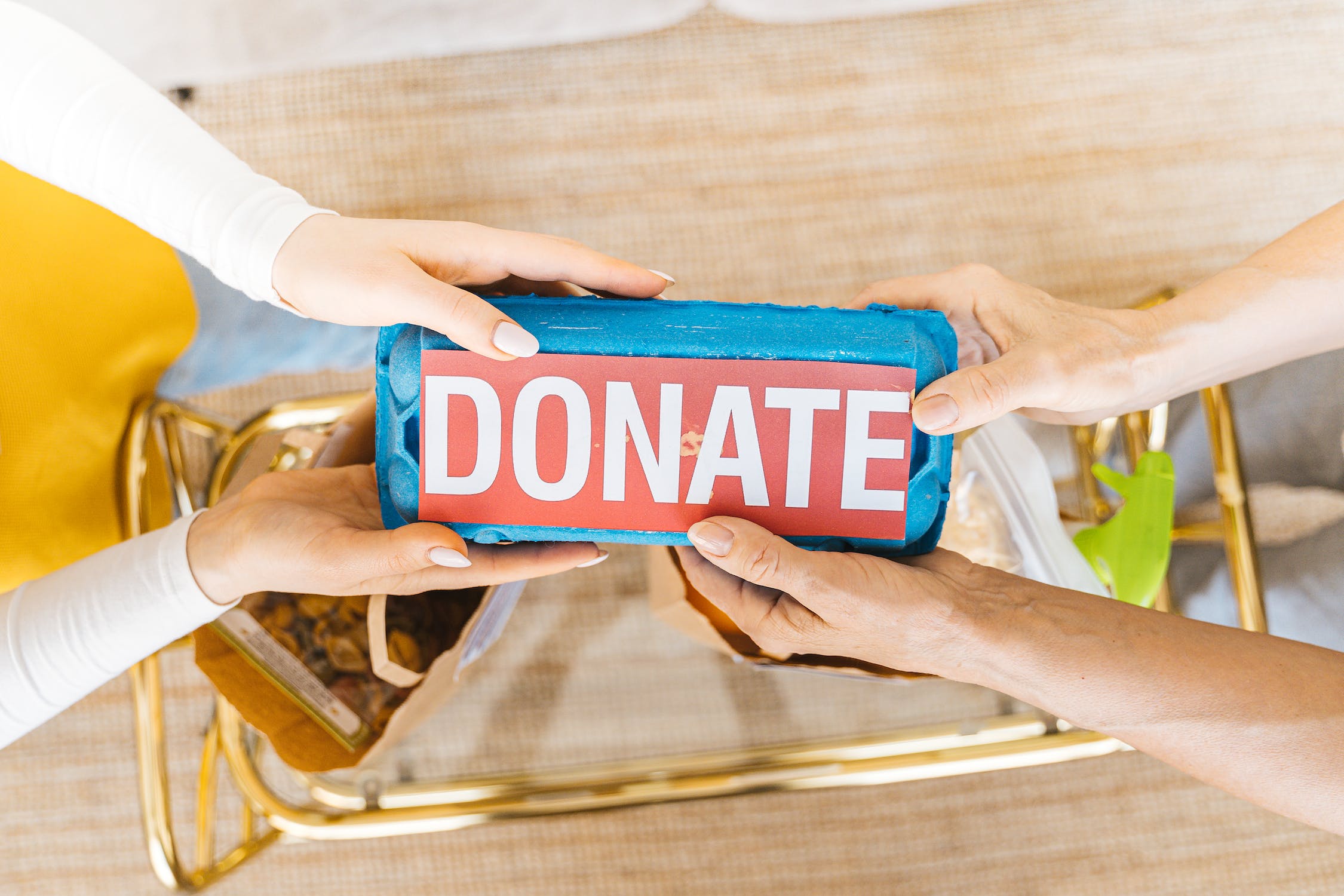 A person holding donation box